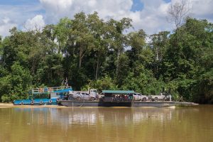 Transporting cars by barge on the Kinabatangan River