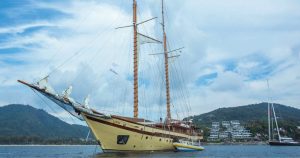 Superyachts anchored off Kata Rocks