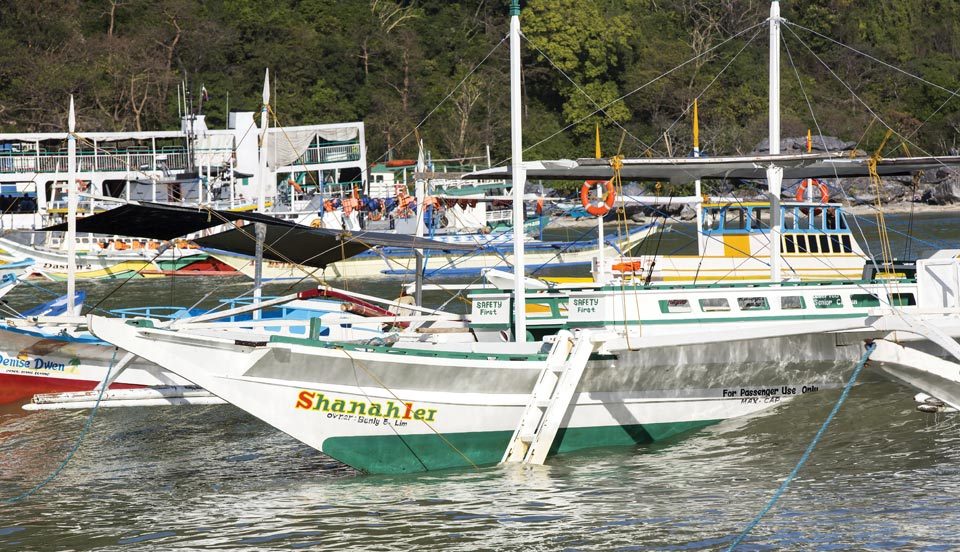 Local fishing boats at El Nido | Photo by Lestertair/Shutterstock.com