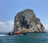 Longtail boat passing in front of Koh Ma Tang Ming