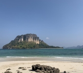 Koh Poda from Koh Tup with rocks in the foreground
