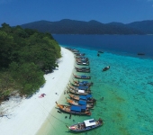 Longtail boats waiting for their guests at Koh Rawi