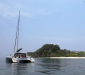 Catamaran Nina crew waiting for the lone speedboat to head somewhere &#039;civilised&#039; for lunch, leaving Koh Chuku deserted.