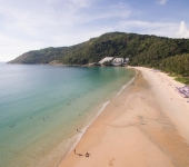 Naiharn Beach, Phuket with the The Naiharn hotel nestled on the hillside